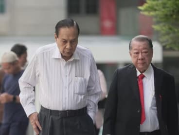 Ng Siak Hai (left) at the State Courts on July 10, 2024, with his lawyer, Mr Choo Si Sen. 