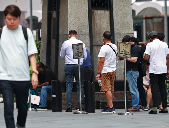 Smokers at a designated smoking point in Orchard Road on Sept 19, 2024. 